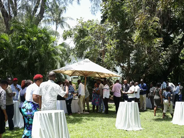 Delegates in the gardens during a break