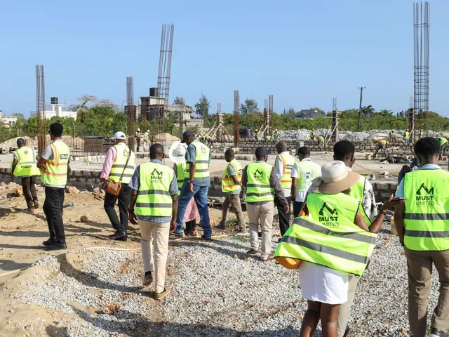 Delegates in high-visibility vests on the Build Tour of Kwale