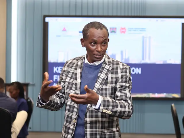 A speaker makes a point to the room