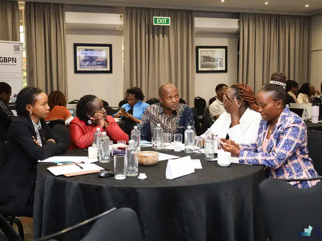 Participants in discussion at their tables